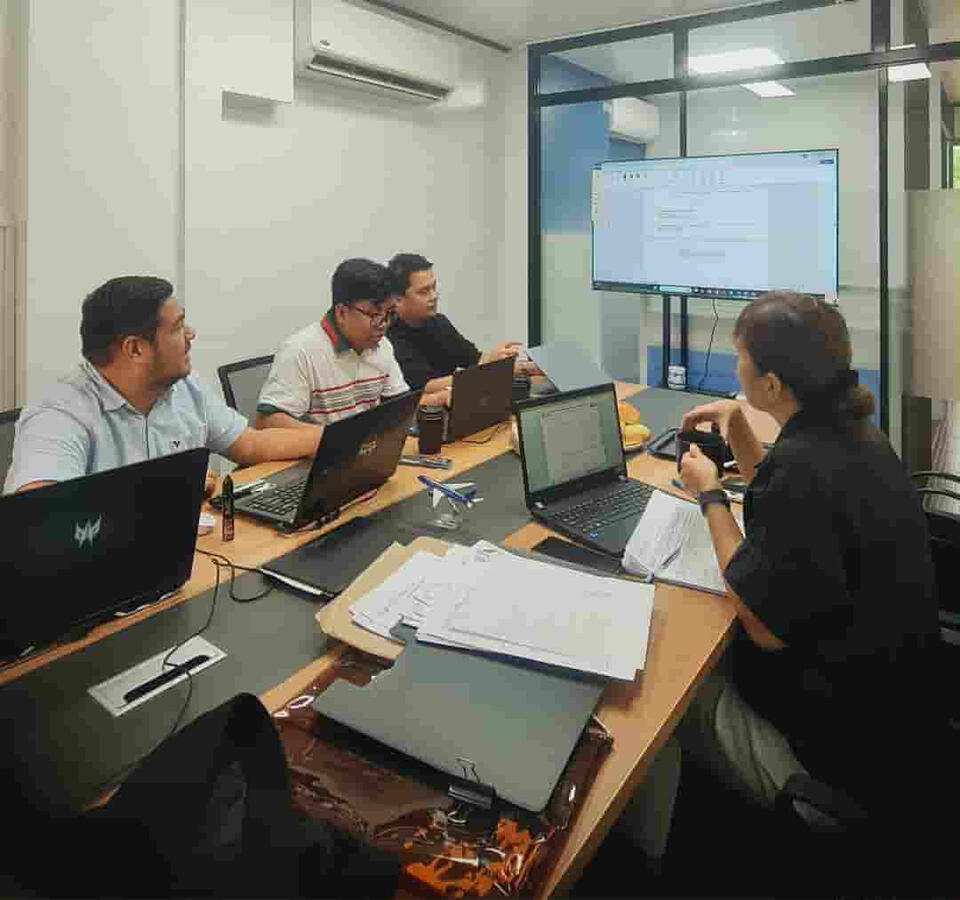 Focused team discussion during a technical session.