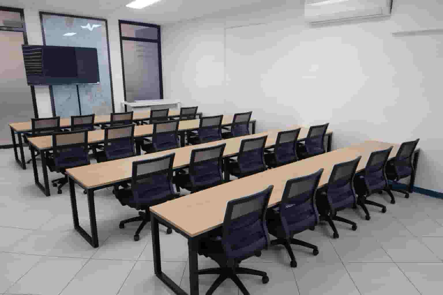 Modern learning spaces. Our training room is equipped with a widescreen display and a navigation map for technical sessions.